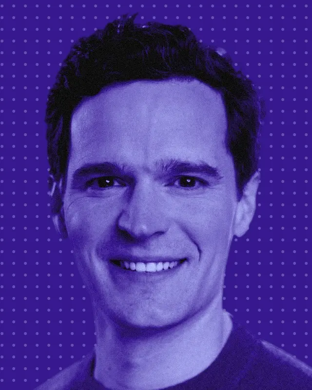 Kyle Conway, smiling, in deep purple and periwinkle tones on a dotted purple background